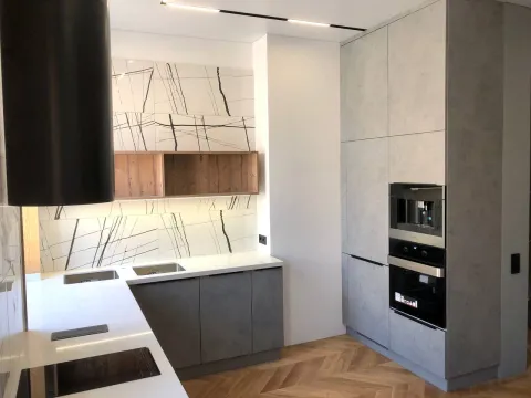 Серая современная кухня под бетон со столешницей под окном